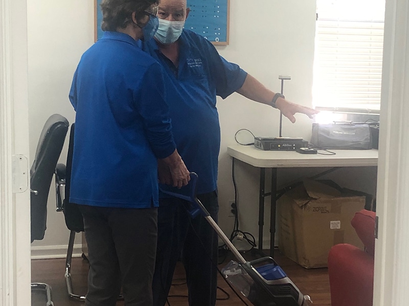 Person learning to vacuum