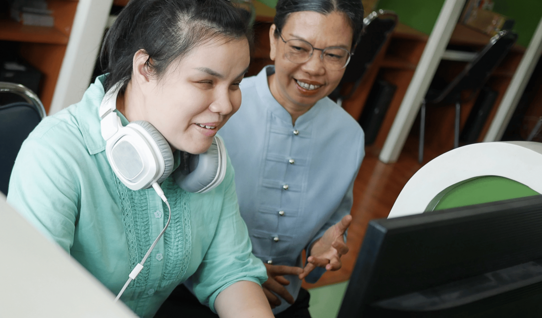 woman learning to use assistive technology